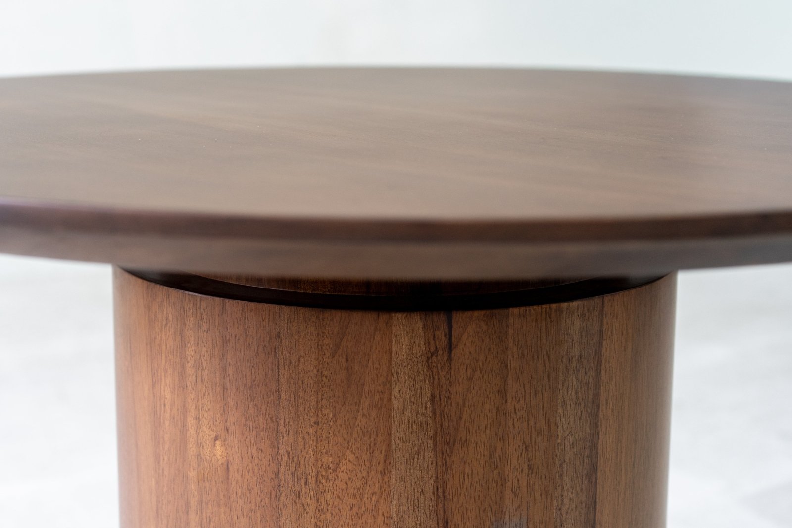 Close-up of the table top showing smoothwoodgrain and beveled edge.